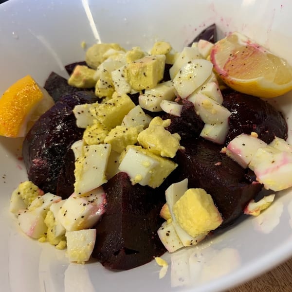 A Patria Station Café beet salad with chopped hard-boiled eggs and lemon wedges.